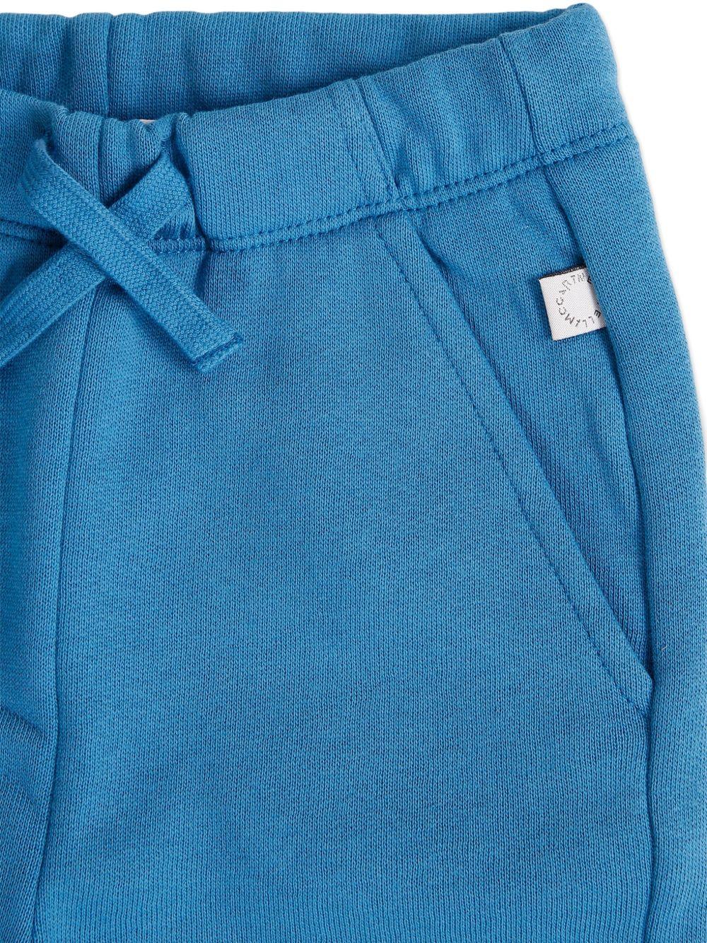 Pantaloni per neonato Stella McCartney Kids blu con stampa grafica - Rubino Kids