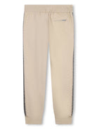 Pantaloni sportivi con bordo a righe per bambino Lanvin Enfant beige con orlo a righe - Rubino Kids