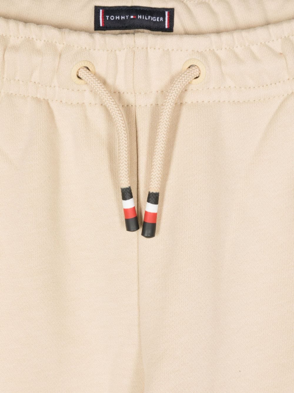 Pantaloni sportivi con ricamo per bambino Tommy Hilfiger Junior beige con logo laterale - Rubino Kids