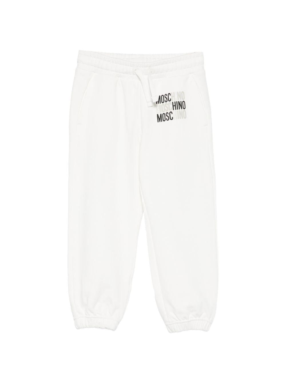 Pantaloni sportivi per bambino Moschino Kids bianchi con logo sul davanti - Rubino Kids