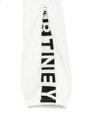 Pantaloni sportivi per bambino Stella McCartney Kids bianco con zip e decorazione sulla manica - Rubino Kids