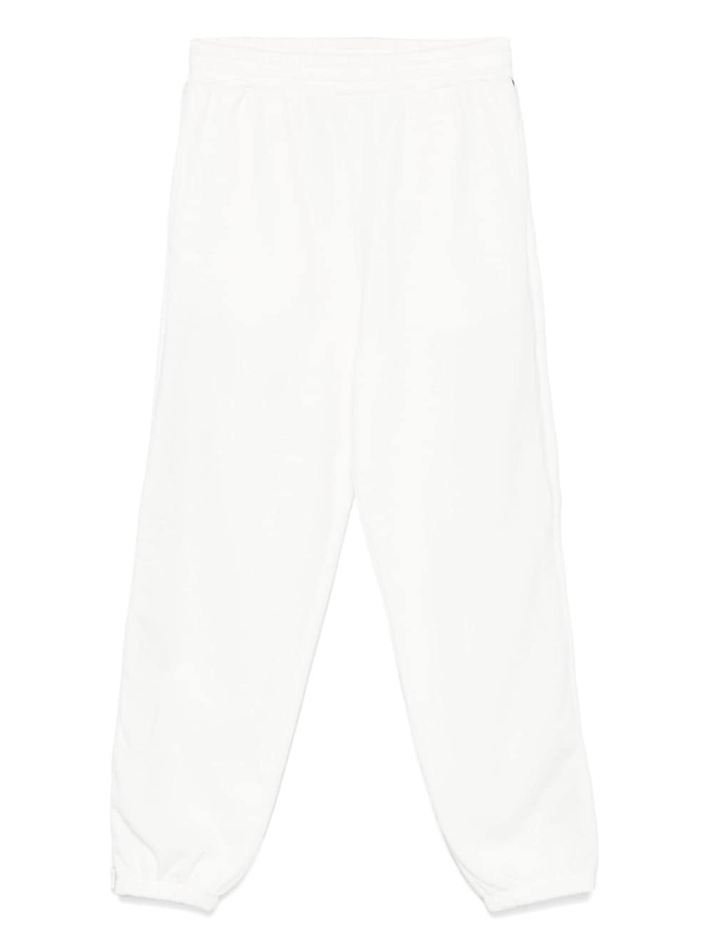 Pantaloni sportivi per bambino Stella McCartney Kids bianco con zip e decorazione sulla manica - Rubino Kids