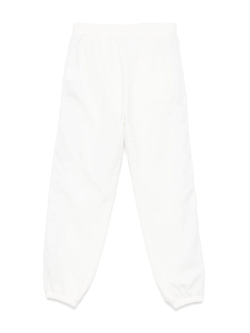 Pantaloni sportivi per bambino Stella McCartney Kids bianco con zip e decorazione sulla manica - Rubino Kids