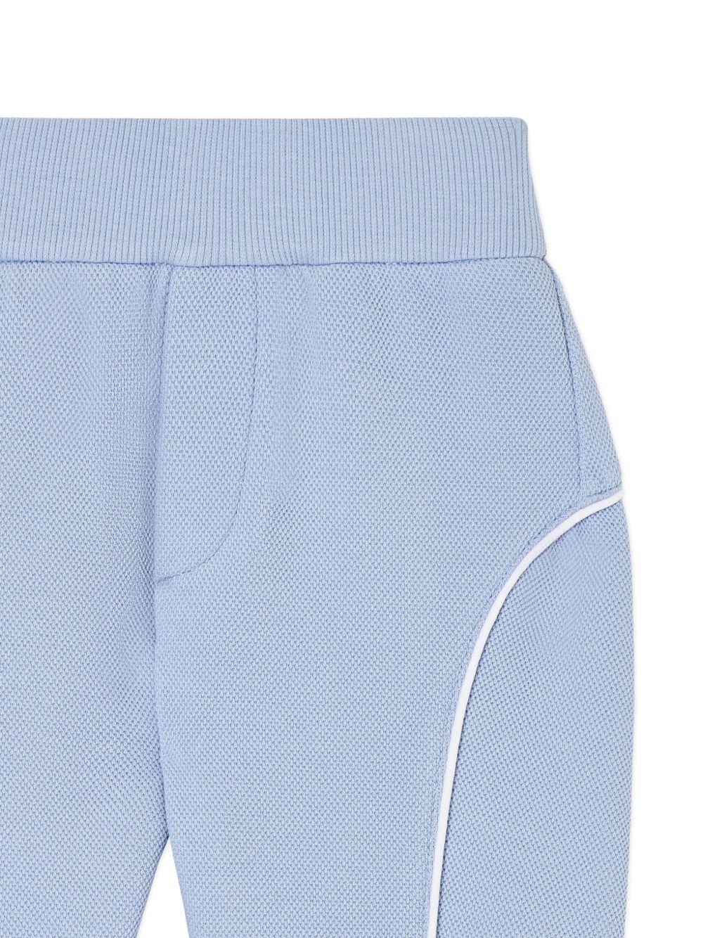 Pantaloni sportivi per neonato Emporio Armani Kids azzurro con logo aquila sul davanti - Rubino Kids