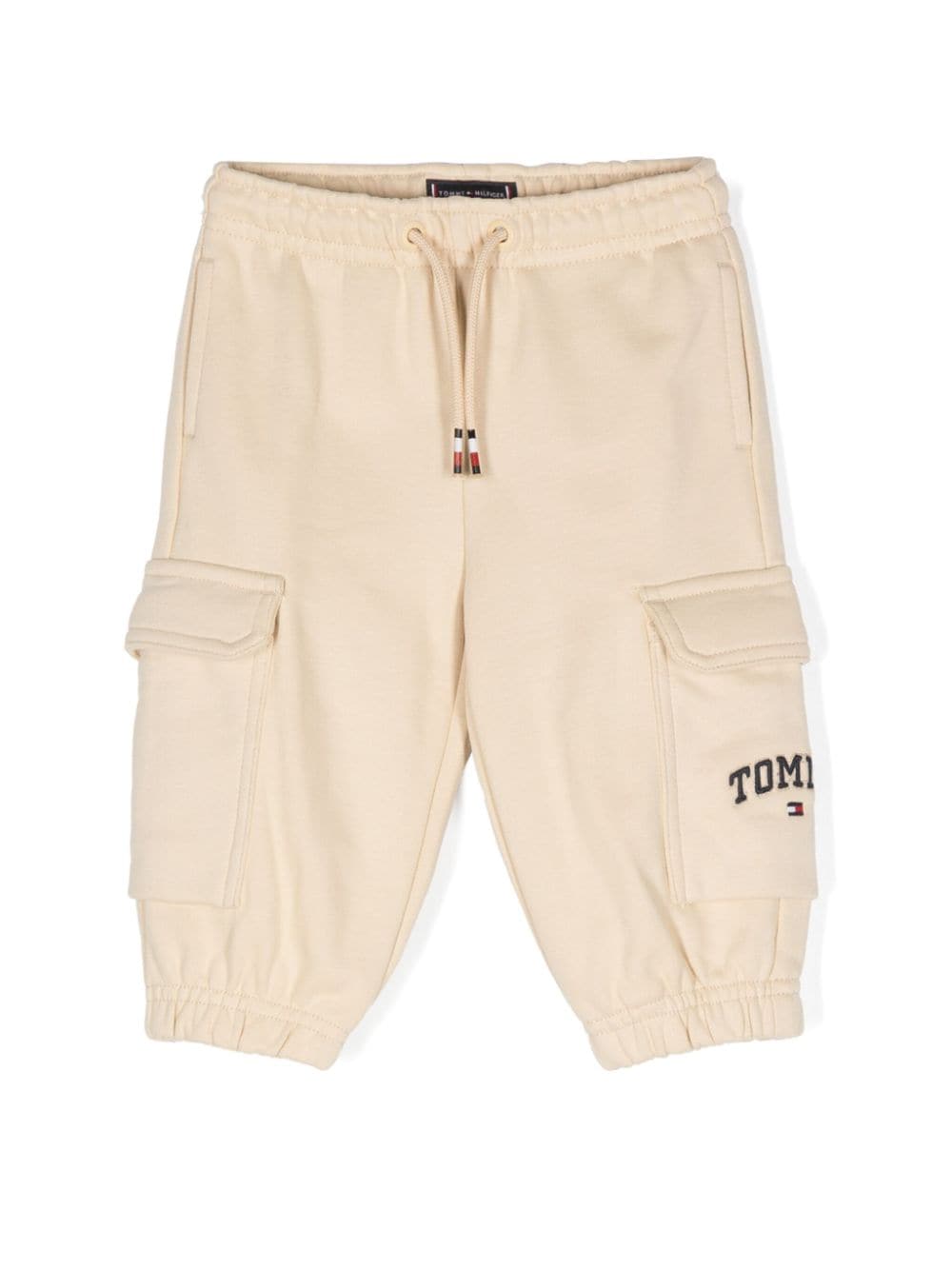 Pantaloni sportivi per neonato Tommy Hilfiger Junior beige con logo sulla gamba - Rubino Kids