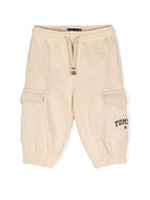 Pantaloni sportivi per neonato Tommy Hilfiger Junior beige con logo sulla gamba - Rubino Kids