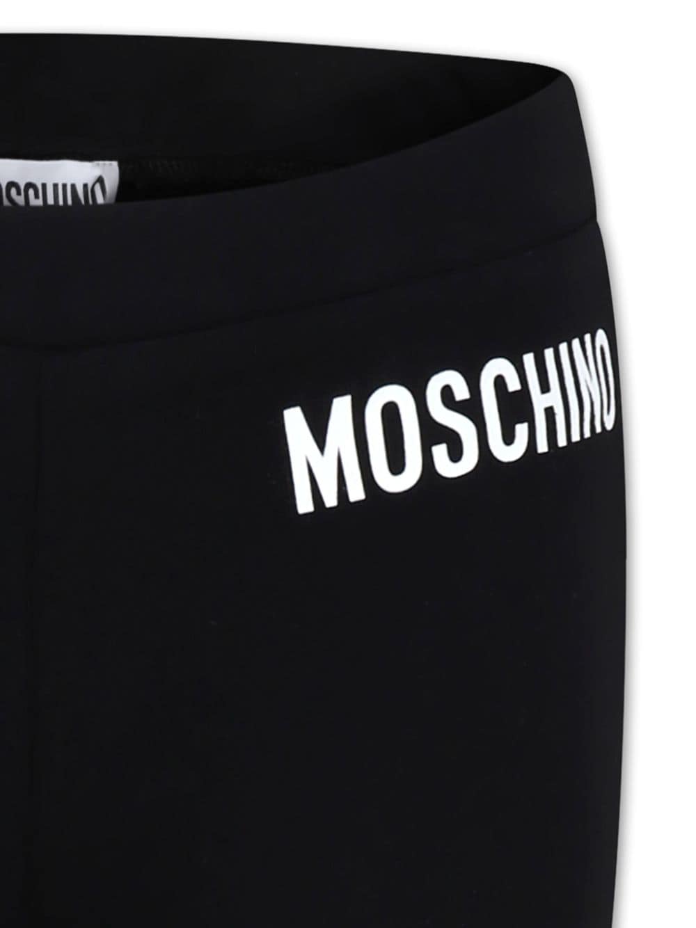 Pantaloni svasati per bambina Moschino Kids nero con stampa logo - Rubino Kids