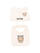 Set berretto e bavaglino per neonati Moschino Kids beige con stampa Teddy Bear - Rubino Kids