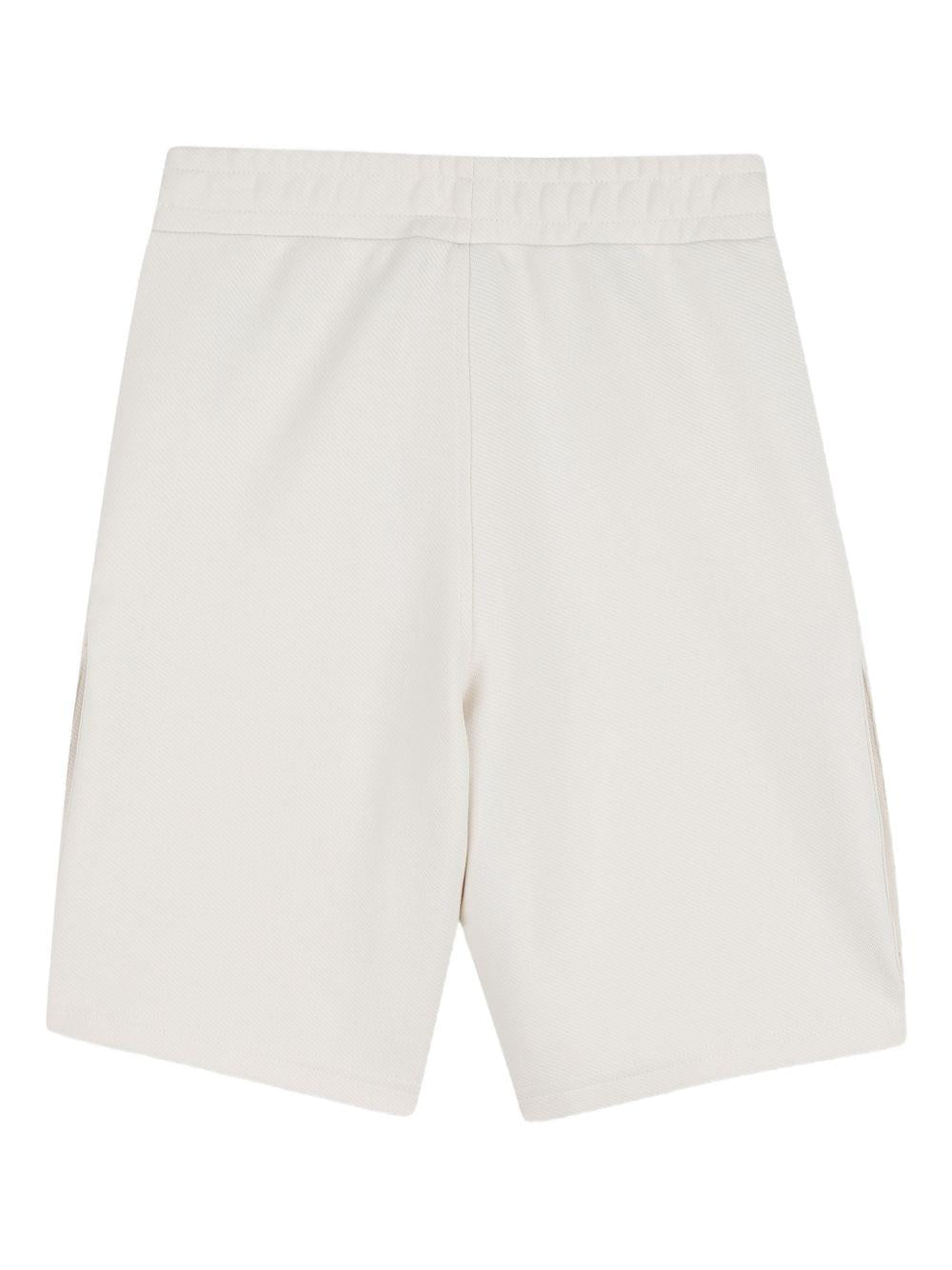 Shorts per bambino Dkny Kids beige con tasche cargo - Rubino Kids
