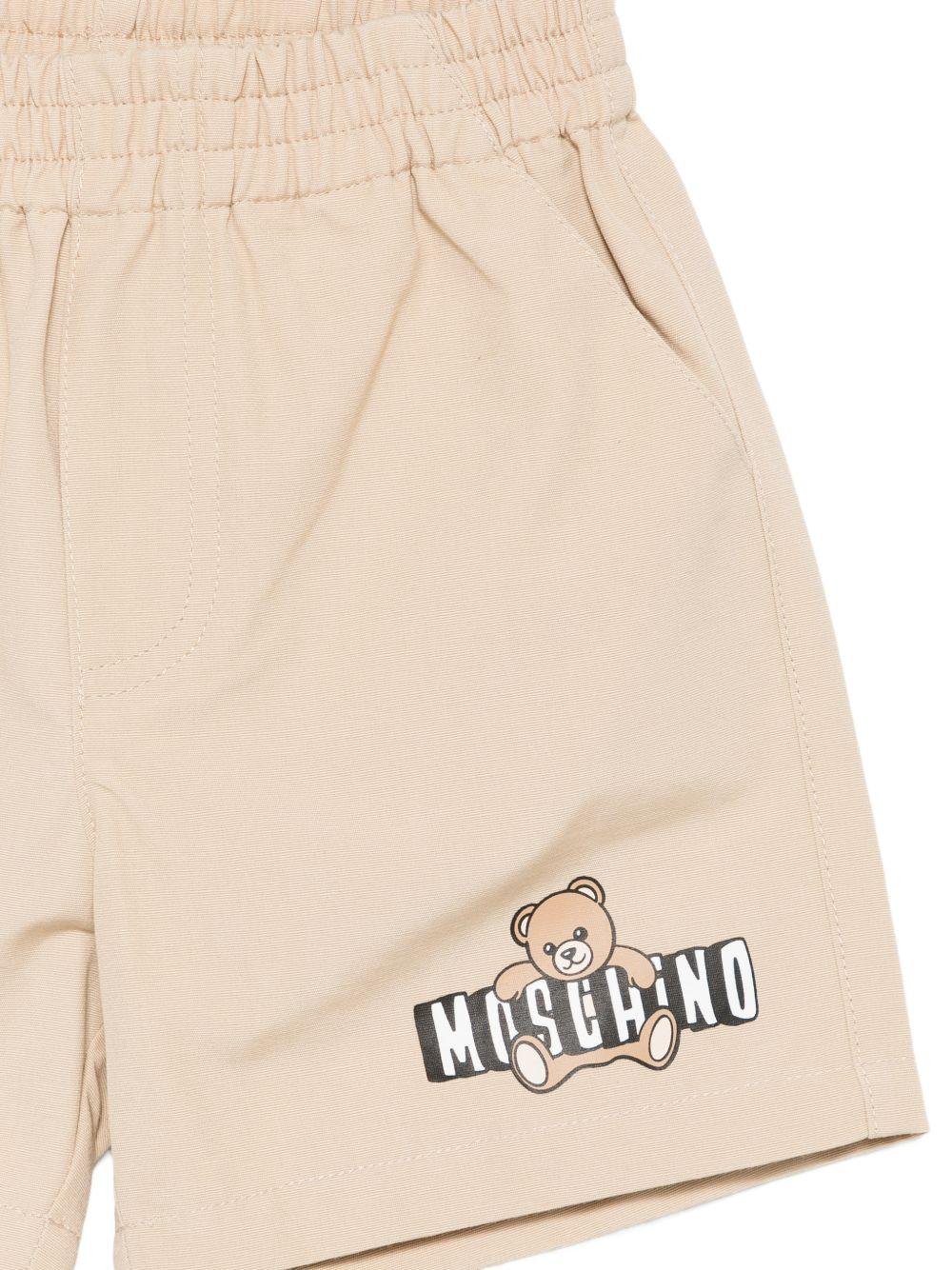 Shorts per neonati Moschino Kids beige con logo sul davanti - Rubino Kids