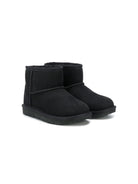 Stivali per bambina UGG Kids Classic II Mini nero con pelliccia - Rubino Kids