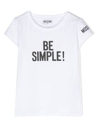 T shirt bianca per bambina Moschino Kids con stampa centrale nera "Be Simple!" - Rubino Kids