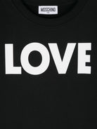 T shirt nera per bambina Moschino con stampa LOVE bianca - Rubino Kids