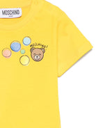 T-shirt per neonati Moschino Kids gialla con stampa grafica - Rubino Kids