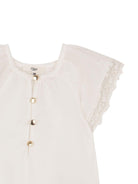 Tuta corta e fascia per capelli per neonata Chloé Kids bianche con bordo in pizzo - Rubino Kids